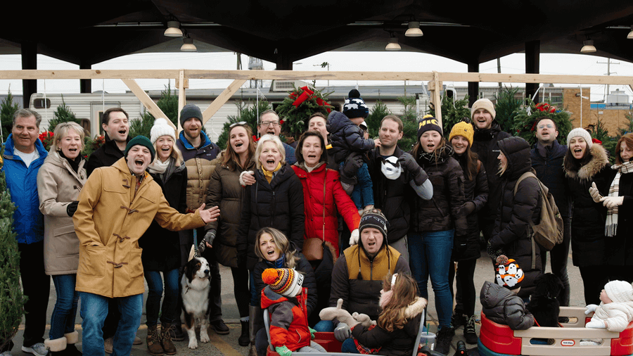 A large family photo at a tree farm