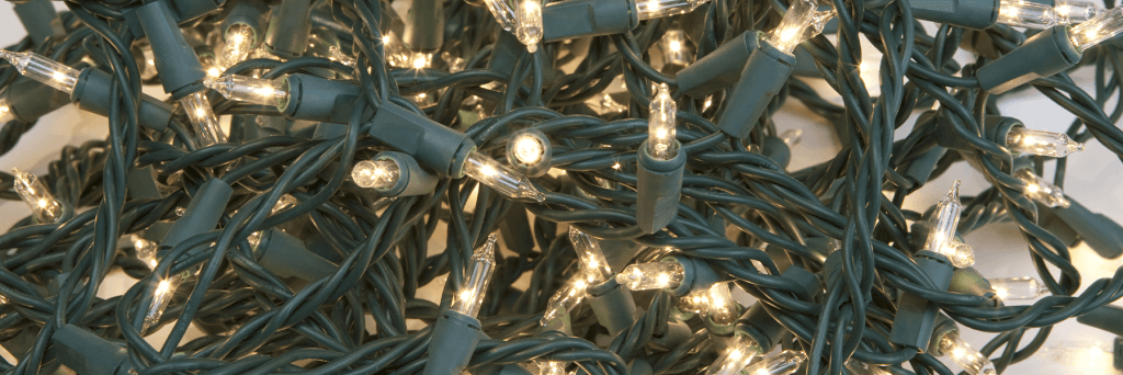 A cluster of Christmas tree string lights that are illuminated